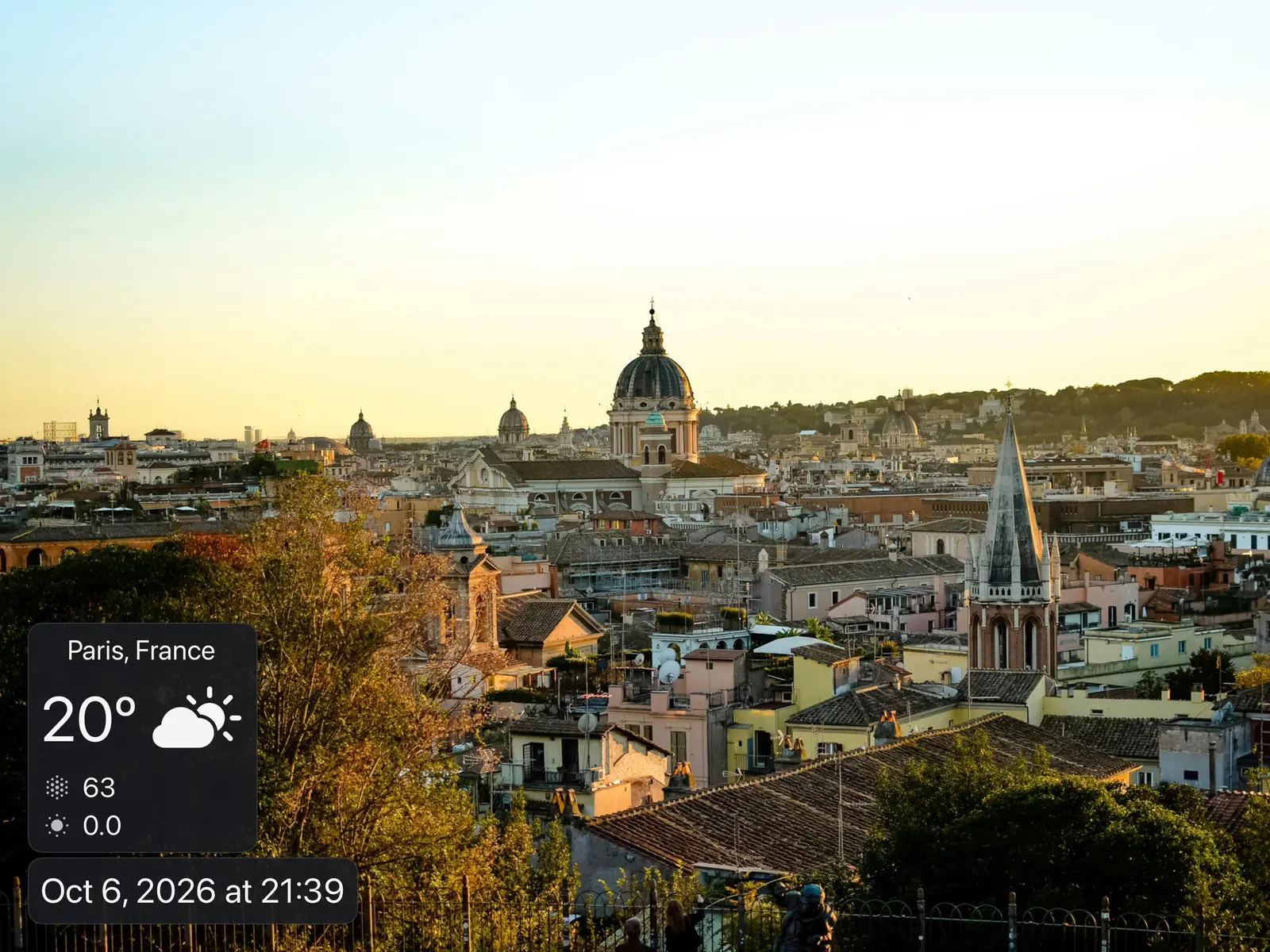 An iPad photo frame playing a slideshow with the weather, date and time